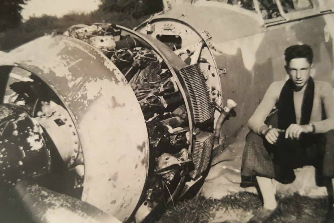 CORRECTION / This handout picture taken in 1940, courtesy of Caillet's family, shows World War II French Resistance fighter Jean Caillet posing next to the wreckage of a French Bloch MB 152 fighter aircraft in Nesle-Hodeng, France.